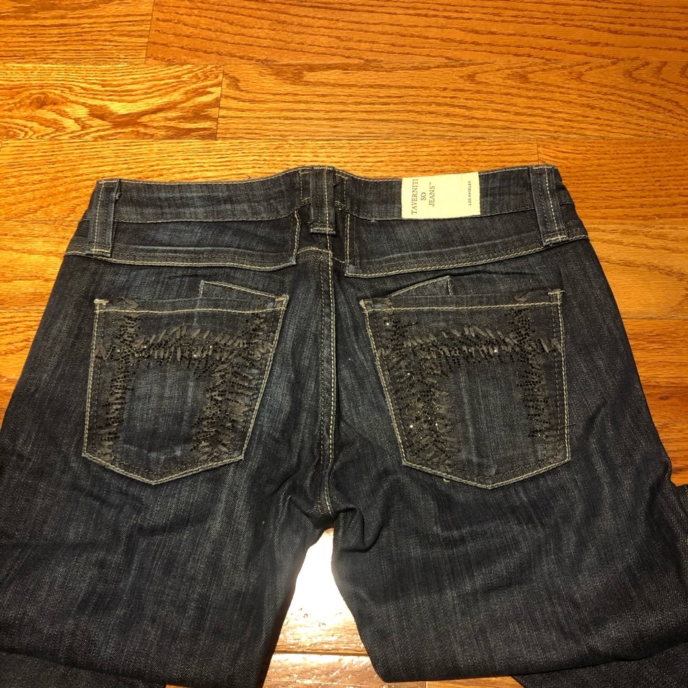 Dark wash skinny jeans by Taverniti So Denim